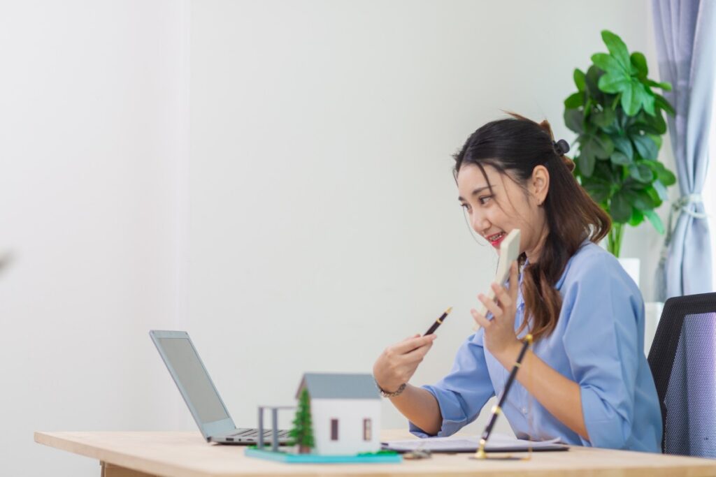 Real estate agents are checking customer information and preparing contract documents selling real estate ready for signing contract to complete the real estate transaction legally