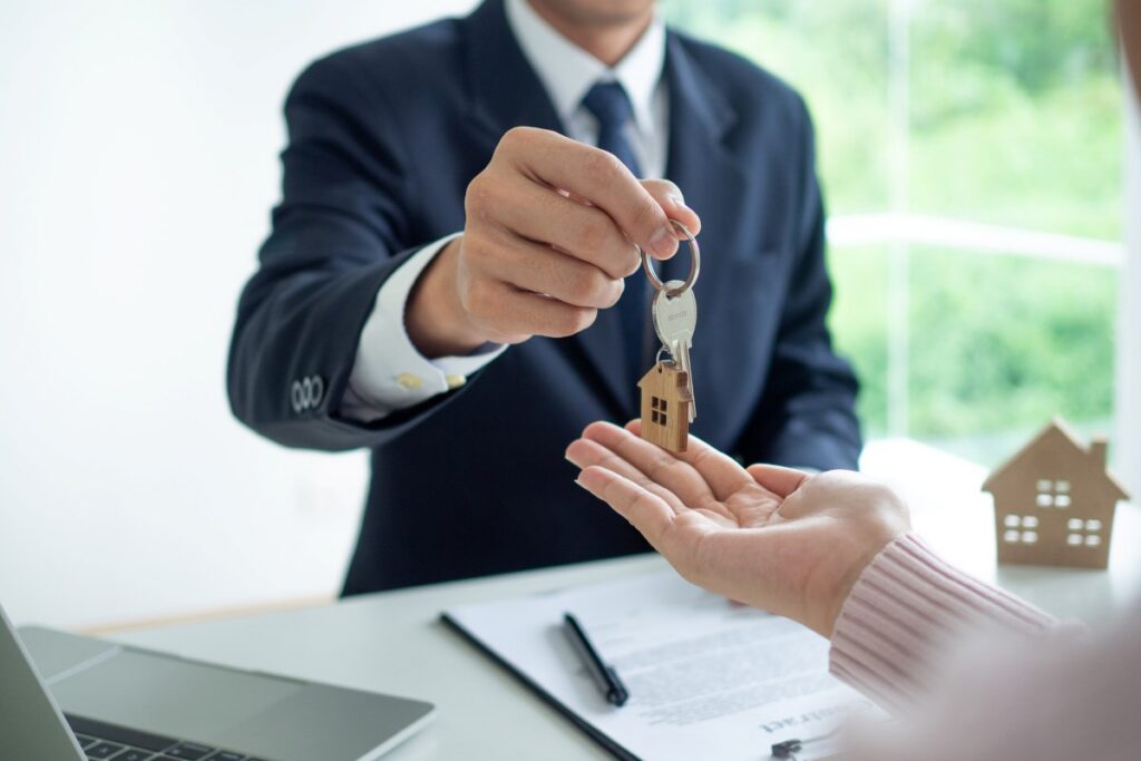 landlords give the house keys to the customer the customer signs the mortgage loan agreement