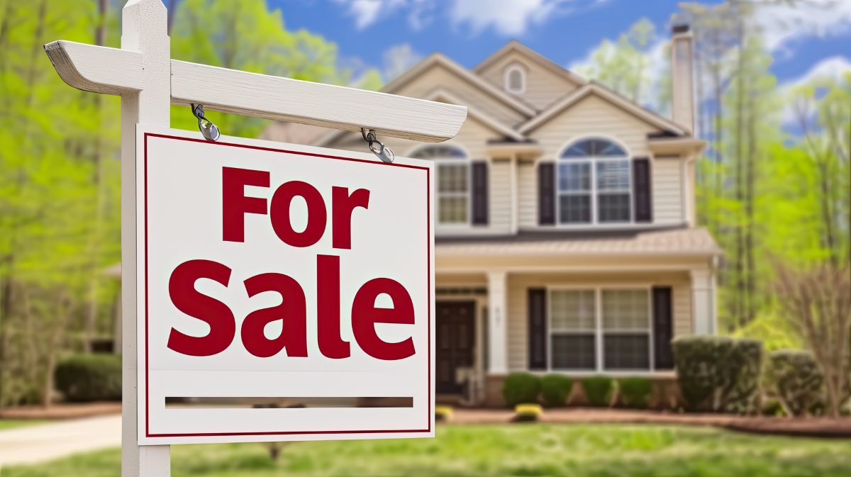 Home for Sale Sign in Front of House
