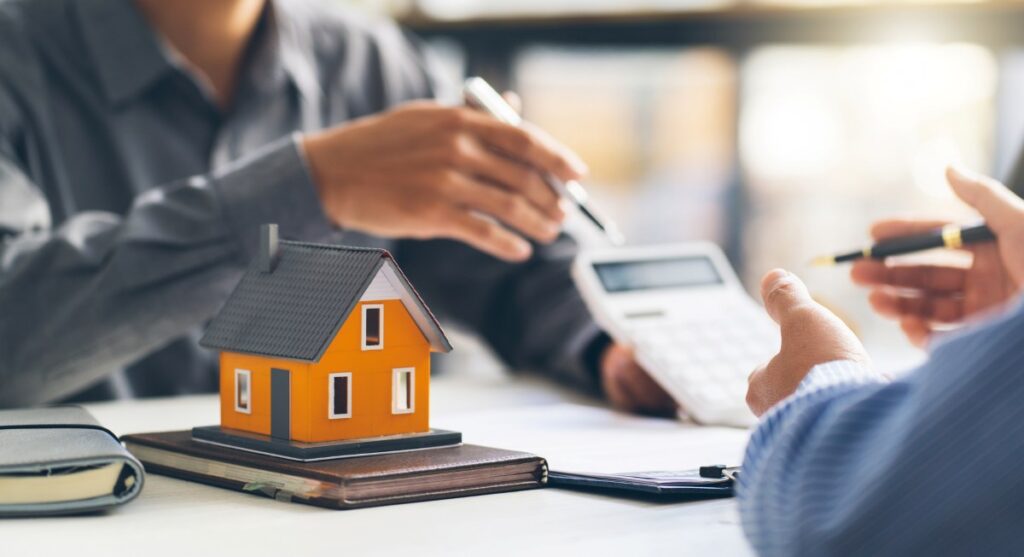 Real estate agent talked about the terms of the home purchase agreement and asked the customer to sign the documents to make the contract legally
