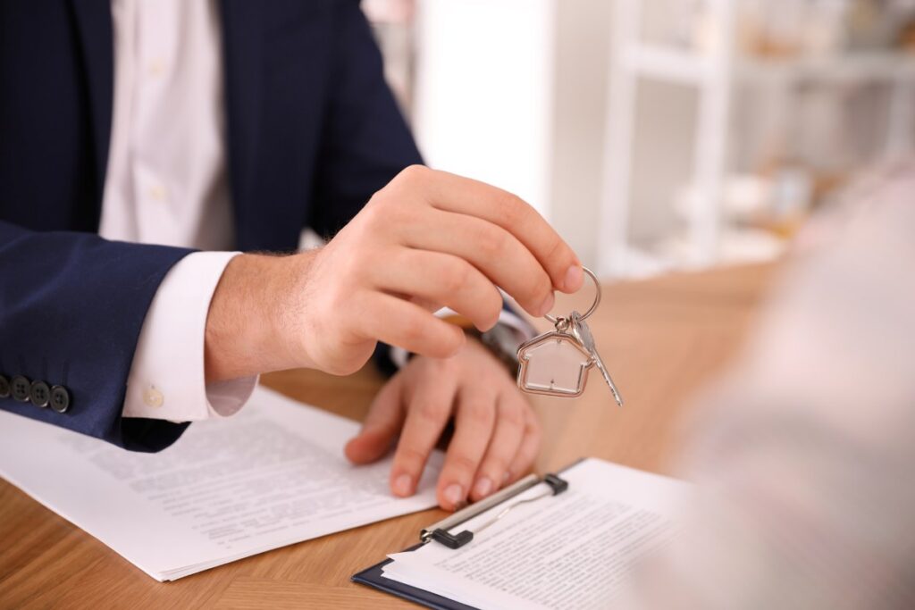 Real estate agent giving key commercial photography asset