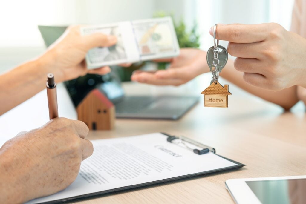 lease, rental and selling home. Real estate agent sent key for new owner