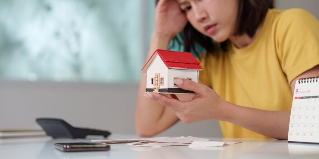 Focused woman analyzing housing investment options