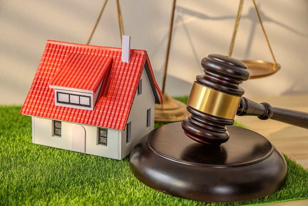 Law concept, Lawyer hands holding judge and house model